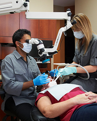 Dr. Pio Modie doing a dental checkup