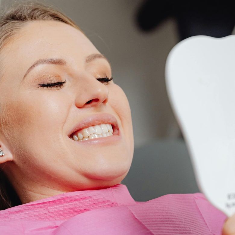 Happy patient after dental implants